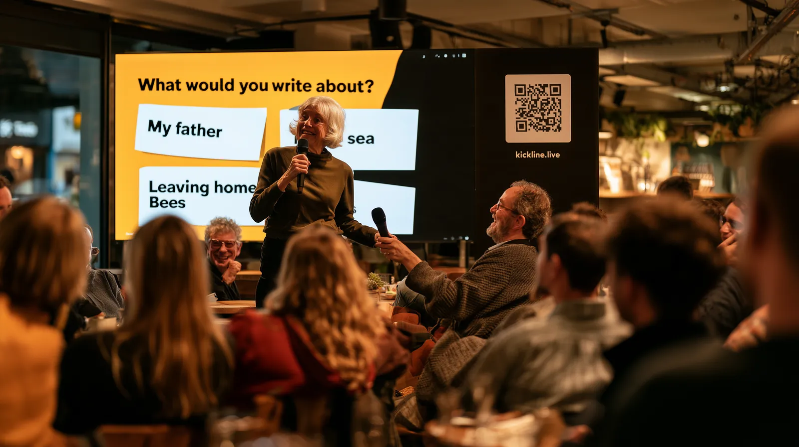 At a cafe talk, someone in the audience takes the microphone and answers the author back